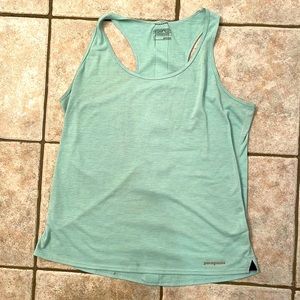 Patagonia aqua women’s Large workout tank. Runs small, cute slits, trendy